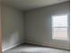 Bedroom with neutral walls, carpet, and a single window at 4514 Eastbrook Pl, Snellville, GA 30039