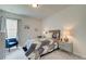Comfortable bedroom featuring a cozy bed with decorative pillows and side tables with lamps at 4514 Eastbrook Pl, Snellville, GA 30039