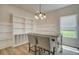 Dining area features custom cabinets, a built-in table, and bright, natural light at 4514 Eastbrook Pl, Snellville, GA 30039