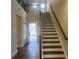 Bright foyer with staircase, hardwood floors, and an open floorplan that offers great natural lighting at 4514 Eastbrook Pl, Snellville, GA 30039