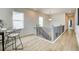 Hallway featuring wood floors, two windows, and spindled railing at 4514 Eastbrook Pl, Snellville, GA 30039