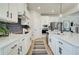 Well-equipped kitchen with white cabinets, stainless steel appliances, and ample counter space for cooking at 4514 Eastbrook Pl, Snellville, GA 30039