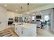 Bright, modern kitchen with stainless steel appliances, ample cabinetry, and a large center island with bar seating at 4514 Eastbrook Pl, Snellville, GA 30039
