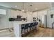 Stylish kitchen featuring a center island with bar seating, stainless steel appliances, and pendant lighting at 4514 Eastbrook Pl, Snellville, GA 30039