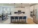 Modern kitchen with a large center island, stainless steel appliances, and sleek cabinetry at 4514 Eastbrook Pl, Snellville, GA 30039