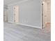 Bedroom with neutral carpet, white trim, and a linen closet at 4651 Larkfield Way, Powder Springs, GA 30127