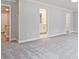 Bright bedroom showcases plush carpeting and doorways to the bathroom and hall at 4651 Larkfield Way, Powder Springs, GA 30127