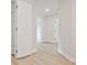 Hallway featuring hardwood floors, and a walk-in pantry at 4651 Larkfield Way, Powder Springs, GA 30127