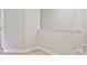 Bright hallway boasts light walls, white trim, and light wood-look flooring at 4651 Larkfield Way, Powder Springs, GA 30127