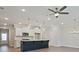 Modern kitchen with a center island, stainless steel appliances, and pendant lighting at 4651 Larkfield Way, Powder Springs, GA 30127