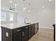 Spacious kitchen featuring a large island with a sink, ample storage, and stainless steel appliances at 4651 Larkfield Way, Powder Springs, GA 30127