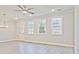 Spacious living room boasts an open floor plan, recessed lighting, and laminate flooring at 4651 Larkfield Way, Powder Springs, GA 30127