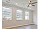 Bright Living Room features a ceiling fan, recessed lights, and large windows that let in natural light at 4651 Larkfield Way, Powder Springs, GA 30127