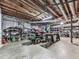 Unfinished basement with visible ceiling beams, exposed ducts, and a work area at 760 Oakdale Rd, Canton, GA 30114