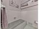 Fresh-looking bathroom showcases a bathtub and white tiled walls with decorative artwork at 760 Oakdale Rd, Canton, GA 30114