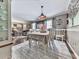 Open dining room area features hardwood floors, a stylish chandelier, and seamless flow to living spaces at 760 Oakdale Rd, Canton, GA 30114