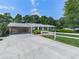 A lovely brick house featuring a carport and a well-manicured lawn at 760 Oakdale Rd, Canton, GA 30114