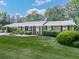 Charming single-story brick home with a well-maintained lawn, lush landscaping, and inviting curb appeal at 760 Oakdale Rd, Canton, GA 30114