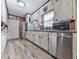 Functional kitchen with stainless steel appliances, ample counter space, and classic cabinetry at 760 Oakdale Rd, Canton, GA 30114