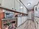 Well-organized kitchen offering abundant storage, stainless steel appliances, and rustic charm at 760 Oakdale Rd, Canton, GA 30114