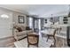 Comfortable living room featuring neutral tones, hardwood floors, and stylish decor at 760 Oakdale Rd, Canton, GA 30114