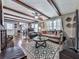 Inviting living room with exposed wood beams, stylish furniture, and decorative fireplace at 760 Oakdale Rd, Canton, GA 30114