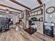 Cozy living room featuring a brick fireplace, built-in shelving, and hardwood floors at 760 Oakdale Rd, Canton, GA 30114
