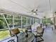 Relaxing screened porch featuring comfortable seating and views of the landscaped backyard at 760 Oakdale Rd, Canton, GA 30114
