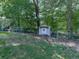 A charming shed is in a fenced area, providing extra storage space at 760 Oakdale Rd, Canton, GA 30114