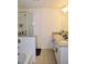 Modern bathroom featuring a double vanity with granite countertops and a glass-enclosed shower at 7624 Squire Ct, Fairburn, GA 30213