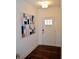 Stylish entryway boasts wood floors and a bright white door with glass panes at 7624 Squire Ct, Fairburn, GA 30213