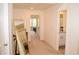 Bright hallway with carpet flooring leads to bathroom and bedroom at 7624 Squire Ct, Fairburn, GA 30213