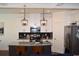 Well-appointed kitchen with granite countertops and sleek stainless steel appliances at 7624 Squire Ct, Fairburn, GA 30213