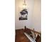 Elegant staircase features wood stairs with white risers and black metal spindles at 7624 Squire Ct, Fairburn, GA 30213