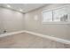 Cozy bedroom featuring clean design, wood-look flooring, and natural light at 8227 Englewood Trl, Riverdale, GA 30274