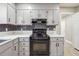 Well-lit kitchen features modern appliances, stylish countertops, and ample cabinet space at 8227 Englewood Trl, Riverdale, GA 30274