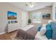 Staged main bedroom with plush bedding, stylish decor, and ample natural light at 8227 Englewood Trl, Riverdale, GA 30274