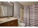 Bathroom featuring a vanity, toilet and shower/tub combo with grey and white curtain at 95 Loudoun Dr, Covington, GA 30014