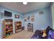 Bedroom featuring carpeted floors, shelving and wall decor at 95 Loudoun Dr, Covington, GA 30014