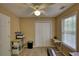 Bedroom featuring a window, double closet and office/storage space at 95 Loudoun Dr, Covington, GA 30014
