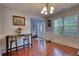 Bright dining area with a stylish table setting, natural light, and views into the welcoming entryway at 95 Loudoun Dr, Covington, GA 30014