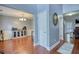 Dining room with hardwood floors, elegant lighting, and stylish decor, adjacent to living spaces at 95 Loudoun Dr, Covington, GA 30014