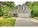 This home has a two-car garage, beautiful landscaping, and stone accents, blending comfort with curb appeal at 95 Loudoun Dr, Covington, GA 30014