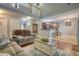 Open-concept living room offering a view of the kitchen and dining area, with hardwood floors and neutral walls at 95 Loudoun Dr, Covington, GA 30014