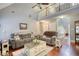 Spacious living room with high ceilings, comfortable seating, and stylish decor, creating a cozy gathering space at 95 Loudoun Dr, Covington, GA 30014