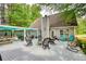 Enjoy outdoor living on this back deck with ample seating, and a sunshade, perfect for relaxation at 95 Loudoun Dr, Covington, GA 30014