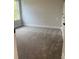 Cozy bedroom with plush gray carpet and natural light from the window at 129 Silvercrest Dr, Acworth, GA 30101