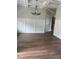 Dining room featuring a coffered ceiling, wainscoting, and dark wood-look tile flooring at 129 Silvercrest Dr, Acworth, GA 30101