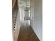Inviting home hallway with wood floors, coffered ceilings, and a stylish chandelier at 129 Silvercrest Dr, Acworth, GA 30101