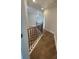 Hallway with hardwood flooring, staircase, and white trim at 129 Silvercrest Dr, Acworth, GA 30101